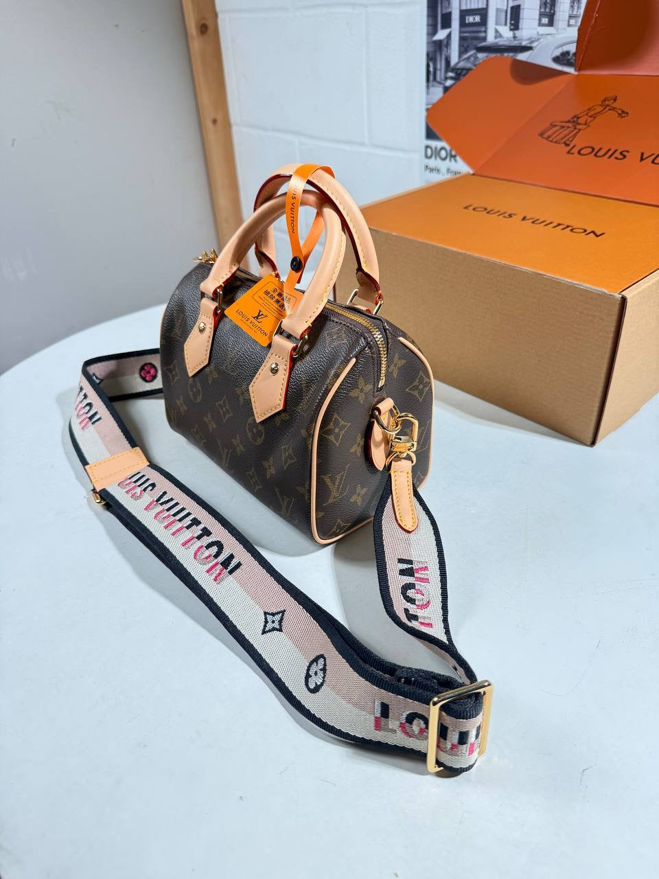 Louis Vuitton nano Speedy bag in monogram canvas with tan leather handles and strap