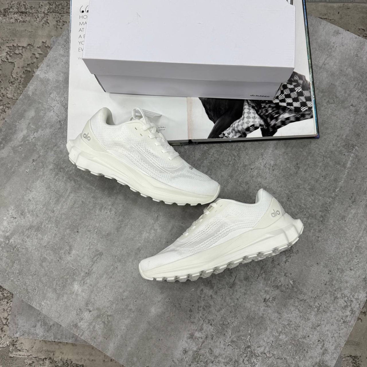 White lace-up training sneakers with textured upper and chunky rubber sole