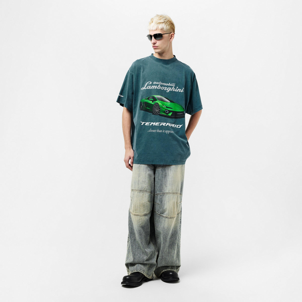 Oversized petrol blue T-shirt with green Lamborghini car print and closer than it appears