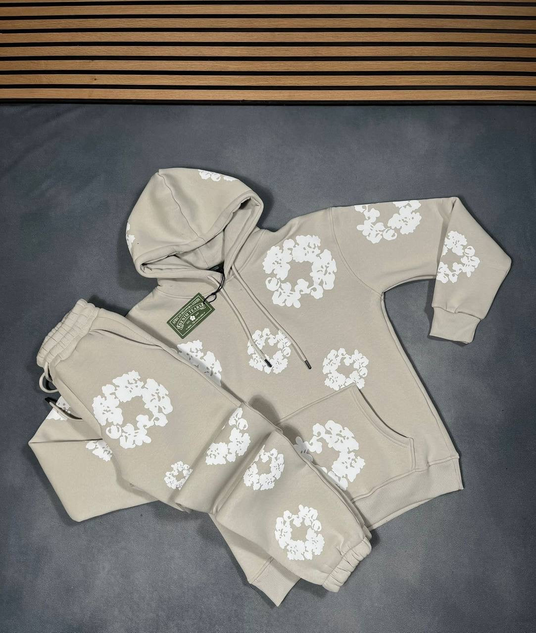 Beige hoodie and jogger tracksuit set with white floral logo pattern