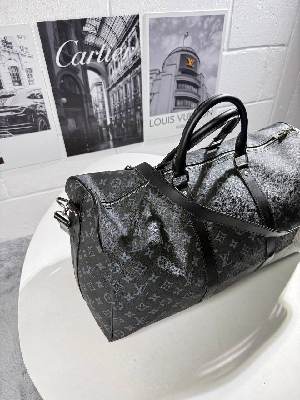 LV monogram carry bag with dual top handles and zippered top, crossbody strap