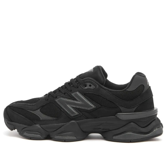 New Balance 9060 in black and grey, side view with textured mesh upper