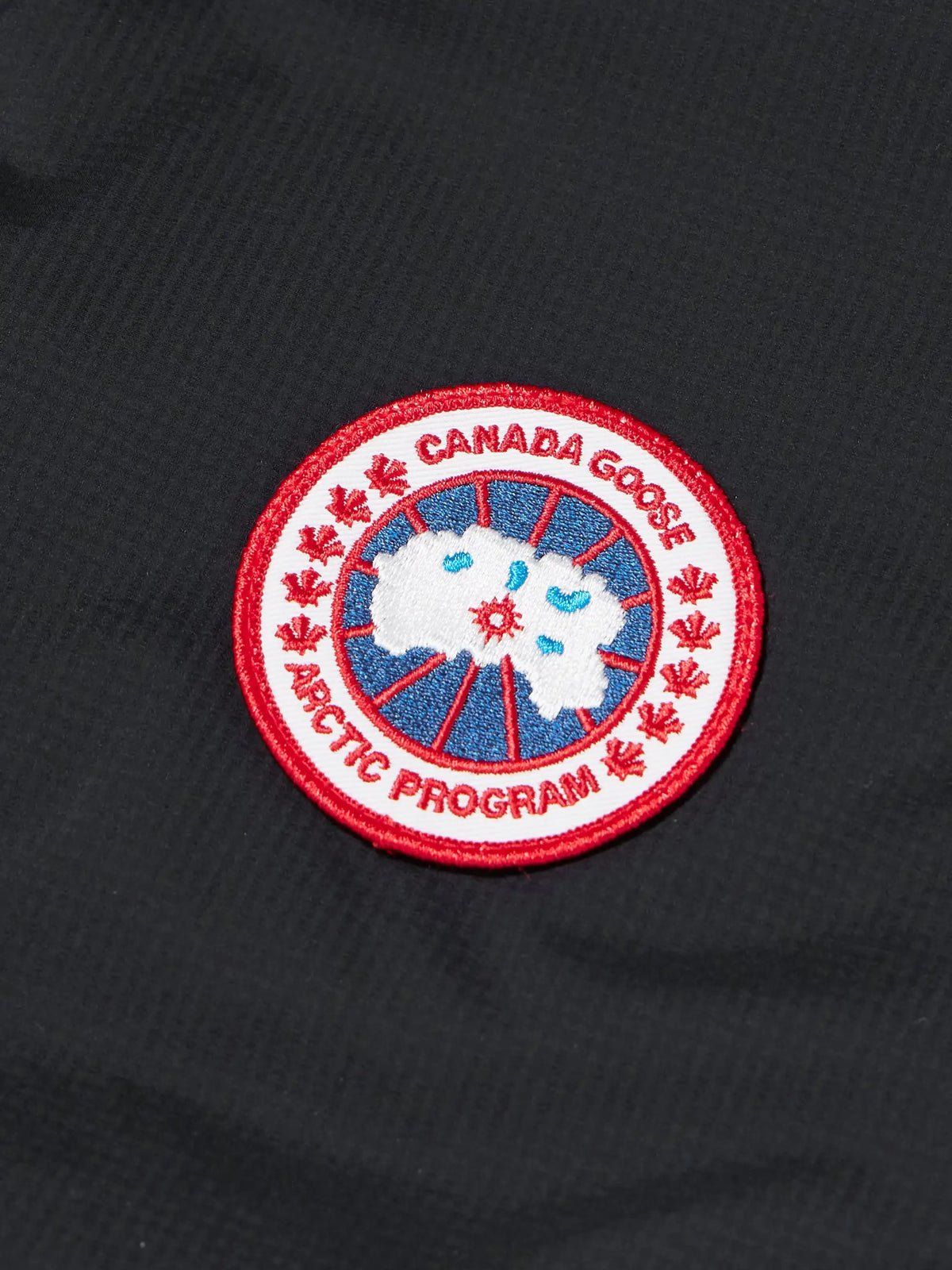 Canada Goose logo patch on black ripstop down gilet fabric