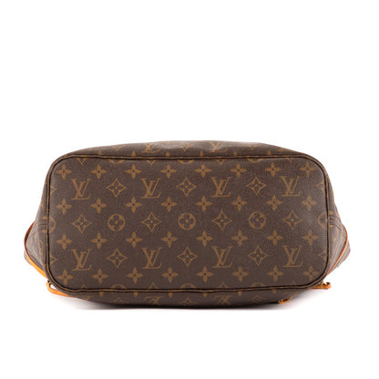 Neverfull tote back panel: dark monogram canvas with curved pocket and tan piping