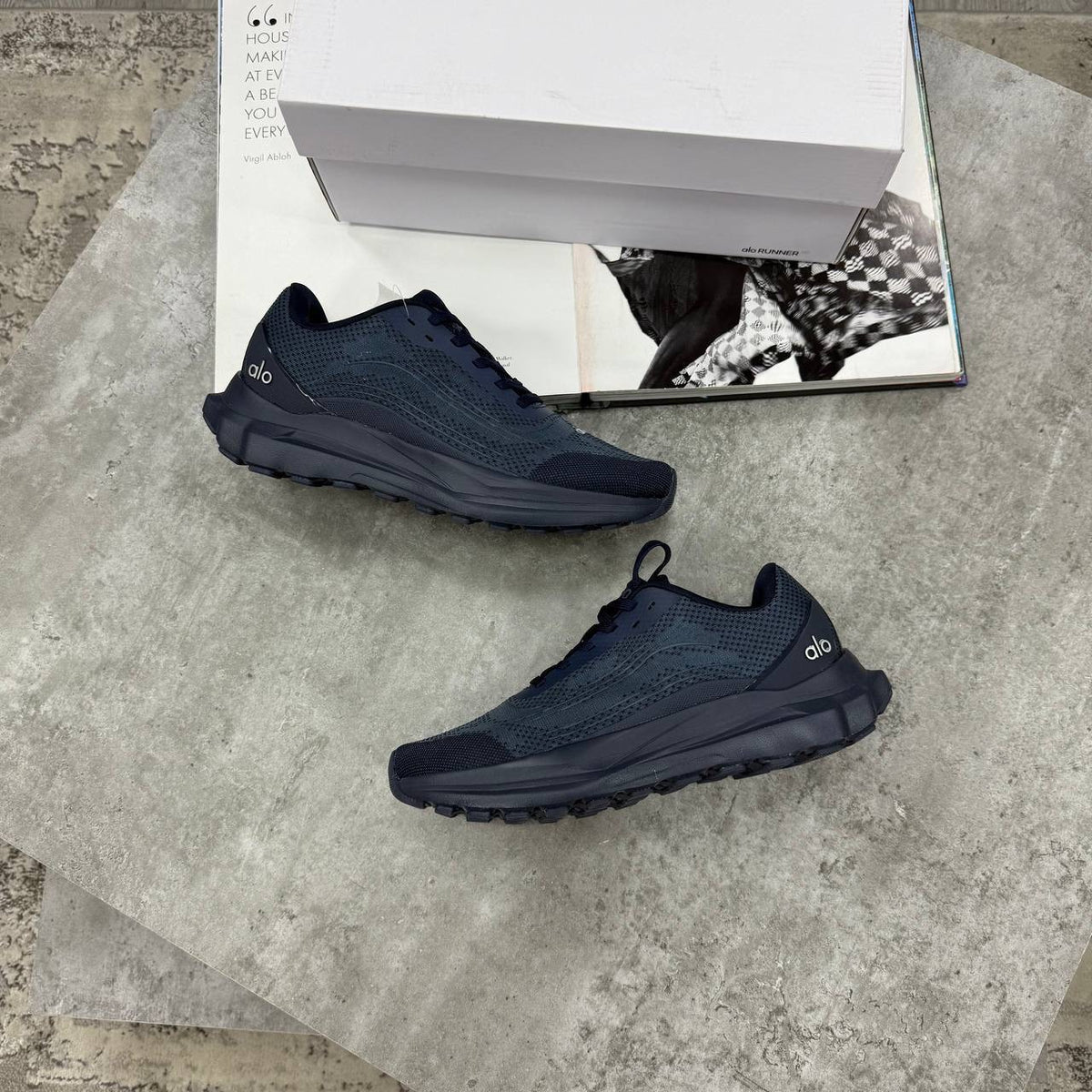 Navy lace-up training sneakers with textured upper and chunky treaded sole