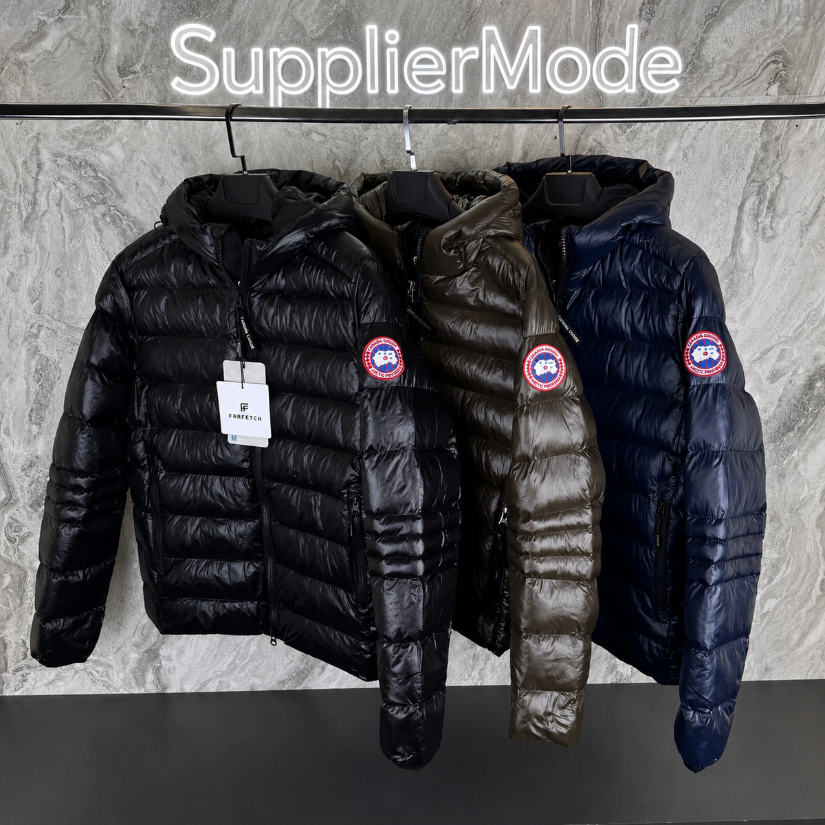 Bubble puffer jackets on a rack: black, olive, and navy with round red logo patches