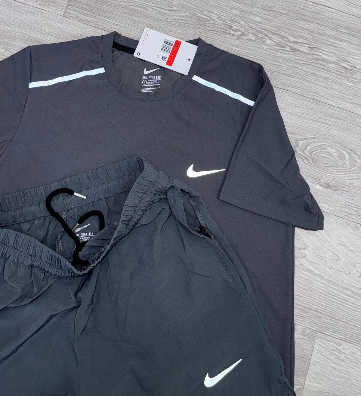 Nike running t-shirt and shorts set, charcoal dark grey with white Nike swooshes