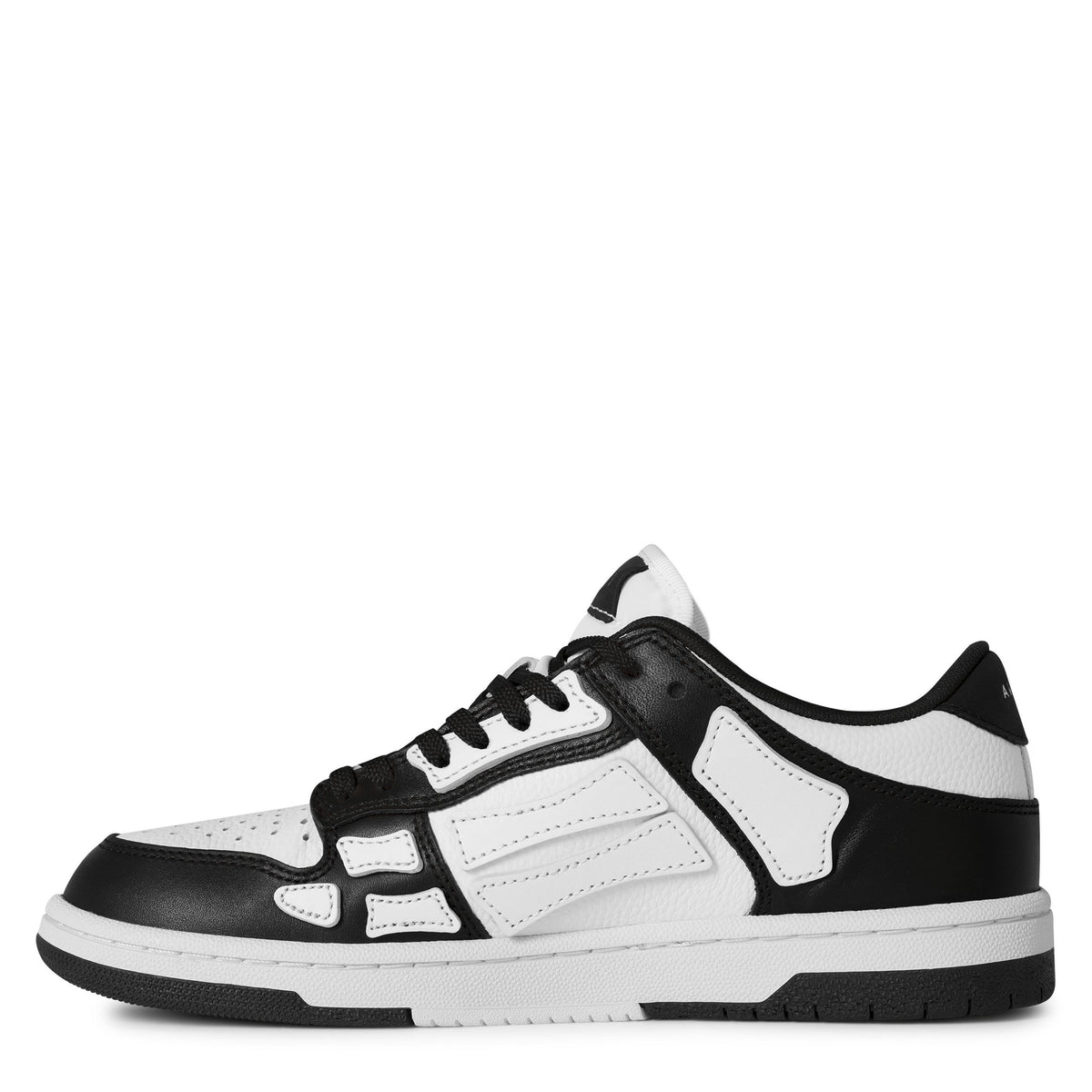 White leather-look low trainers with black side overlays and lace-up