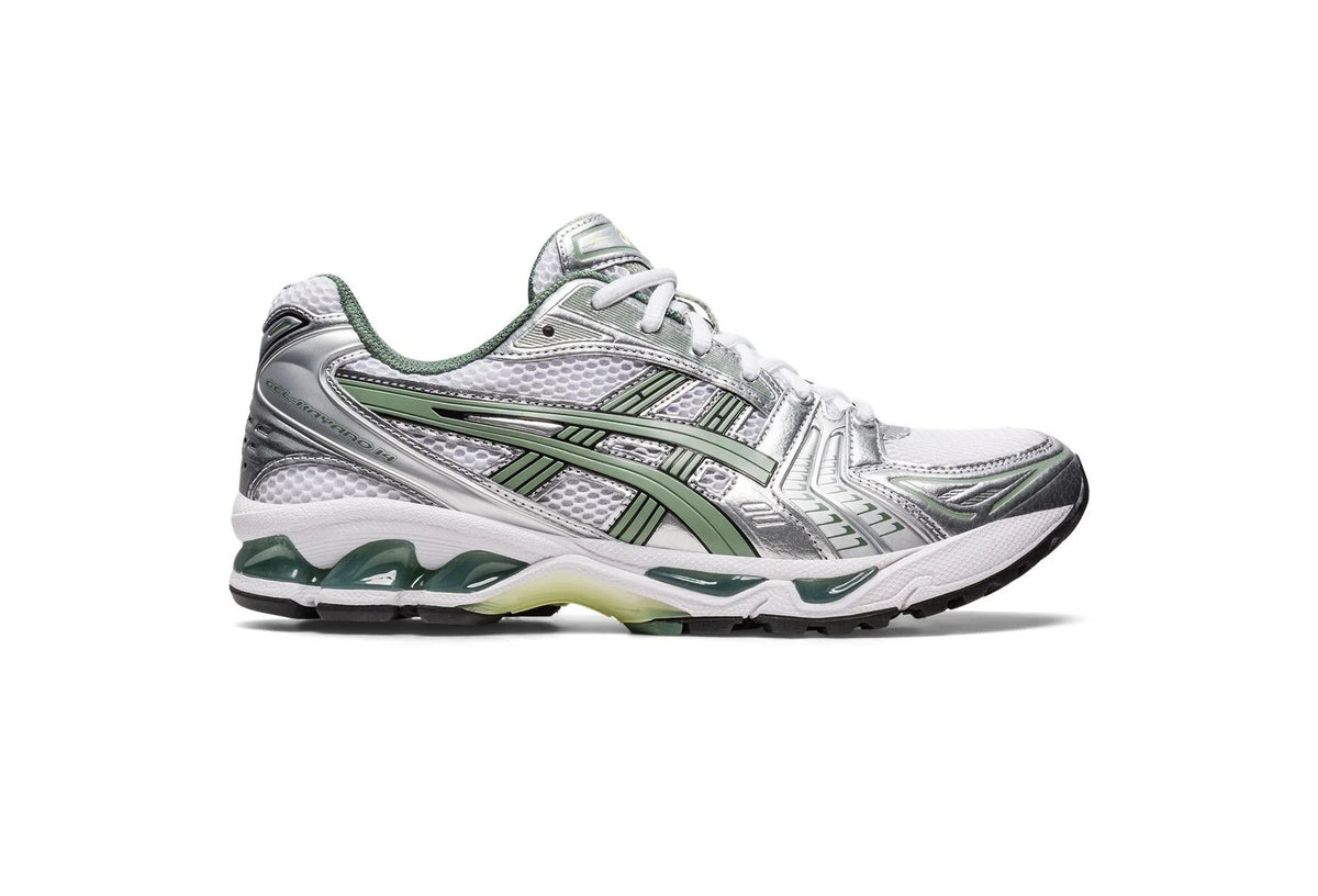 Gel Kayano 14 sneaker side view, pure silver upper with green striping and laces