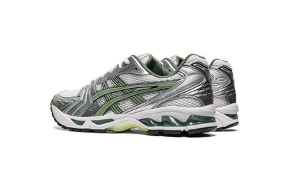 Gel Kayano 14 sneaker angled side/heel view in silver with green stripes and padded collar