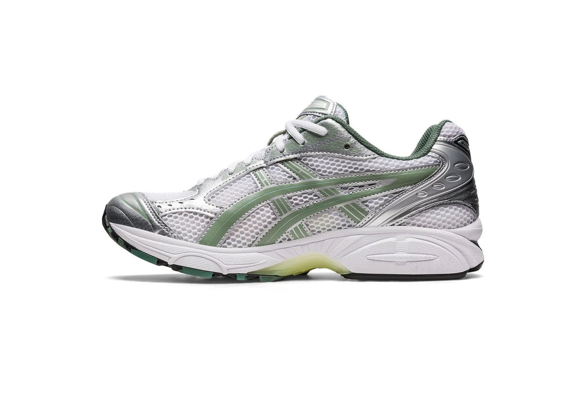 Gel Kayano 14 shoe profile with mesh panels, silver overlays, and green heel details