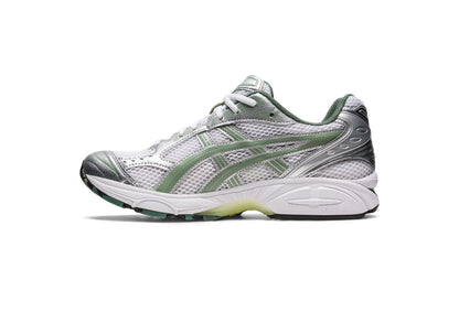 Gel Kayano 14 shoe profile with mesh panels, silver overlays, and green heel details