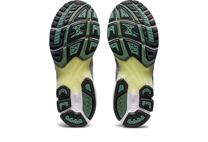 Gel Kayano 14 outsole view with textured tread, dark rubber sections, and green markings