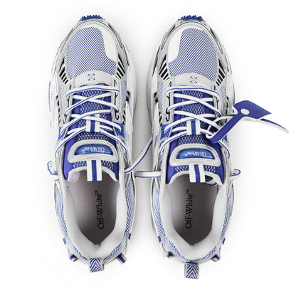 White and blue retro comfort sneakers with mesh upper and blue lace-up front straps.
