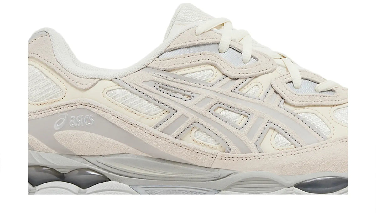 White upper close-up with laces, stitched stripes, and cushioned gel midsole