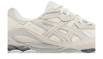 White upper close-up with laces, stitched stripes, and cushioned gel midsole