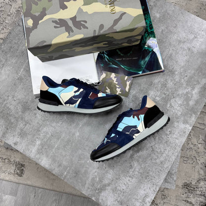Navy and black Rockrunner sneakers with light blue panels, lace-up low tops