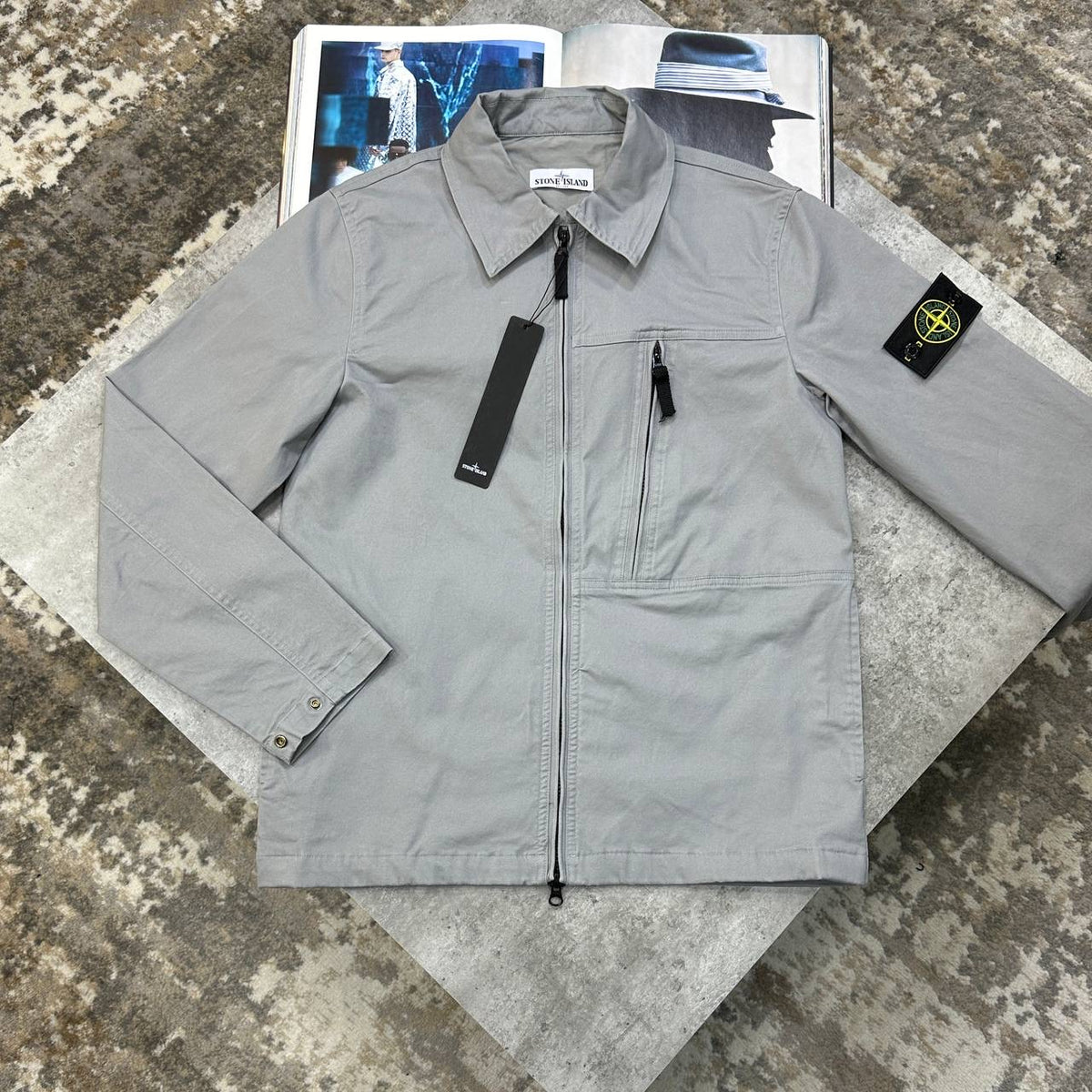 Grey overshirt jacket, full front zip, stand collar, side pockets.