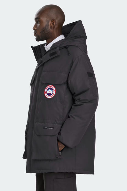 Expedition Parka Black, side profile with Canada Goose patch and zip pockets