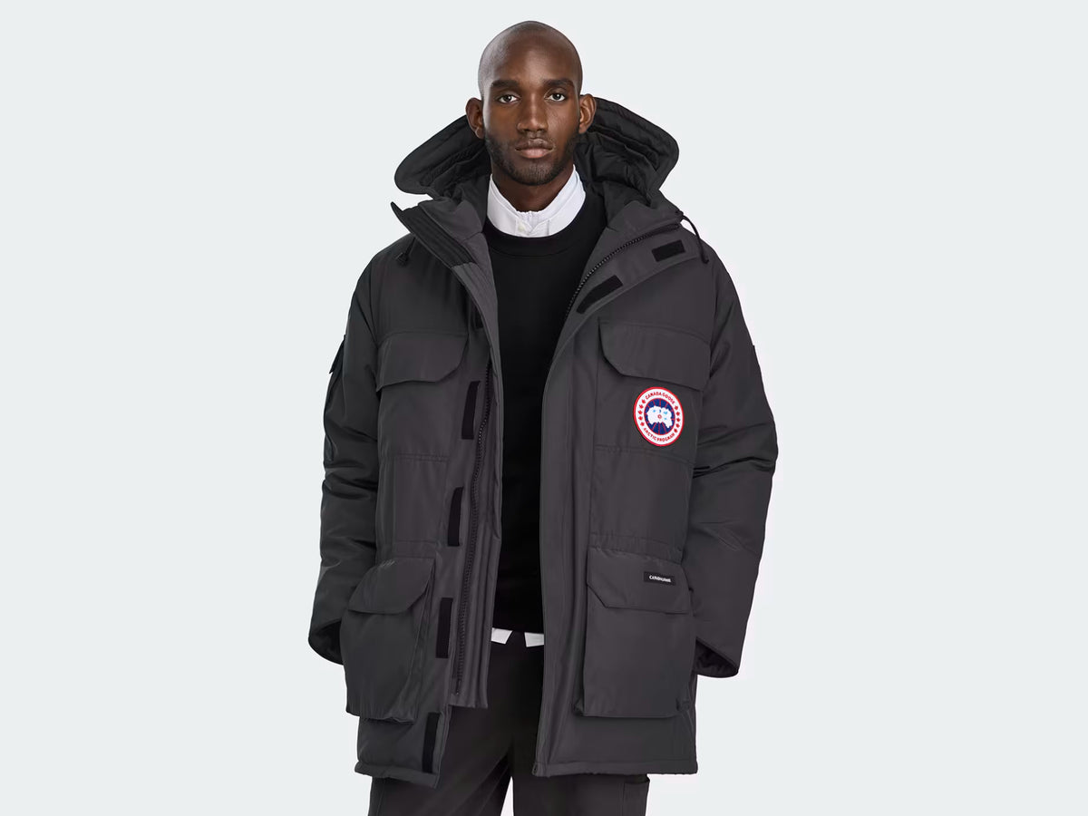 SupplierMode Expedition Parka Black, front view with hood and insulated cargo pockets