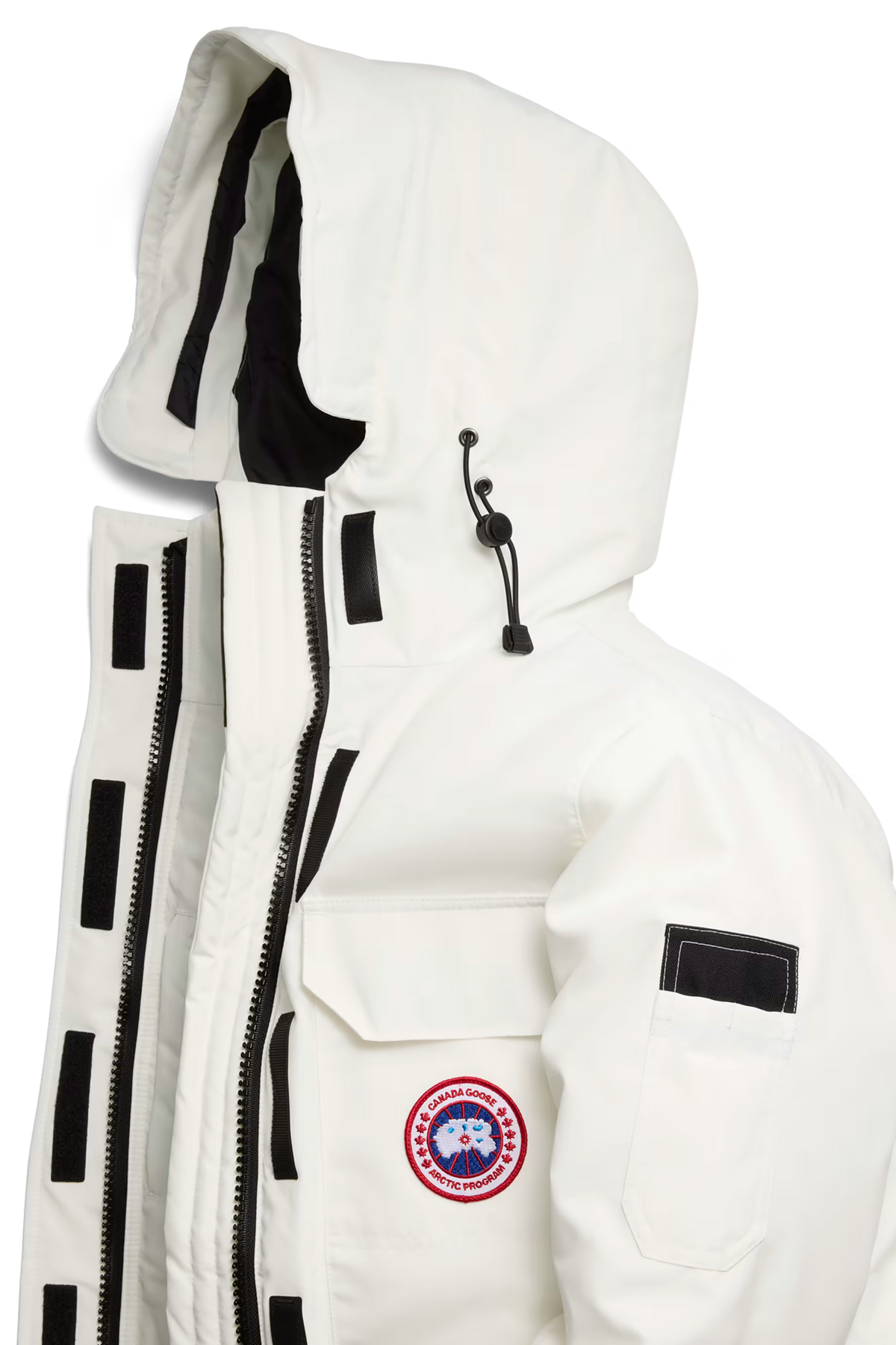 Expedition Parka femme blanc cassé gros plan, capuche, fermeture zippée et écusson rond