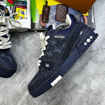 Navy LV trainers with monogram denim look, white laces, and chunky side sole.
