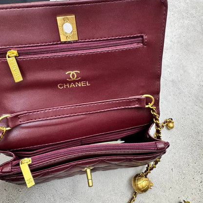 Burgundy quilted CC flap bag with gold-tone chain and turn-lock clasp