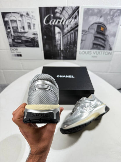 Silver trainers with heel strap and CHANEL logo panel, chunky sole