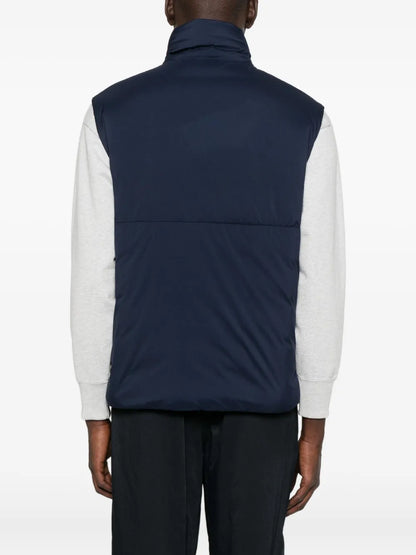 Back view of navy quilted gilet with high collar and horizontal baffle seams