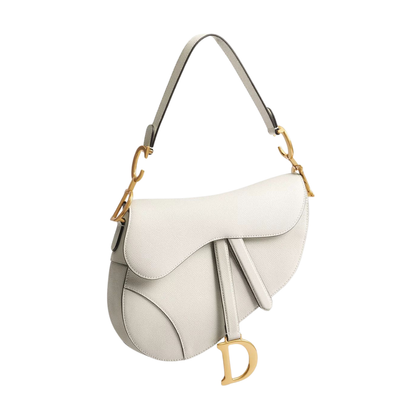CD Saddle Bag with Strap, cream with curved flap and tassel D charm