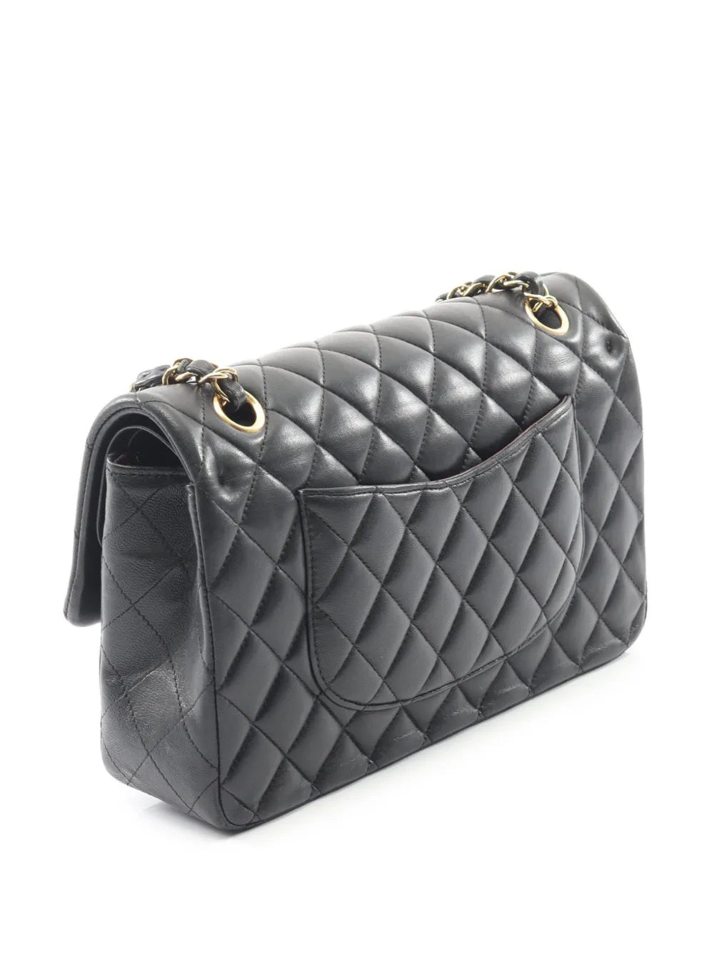 Black quilted shoulder bag with gold chain, side profile and quilted flap