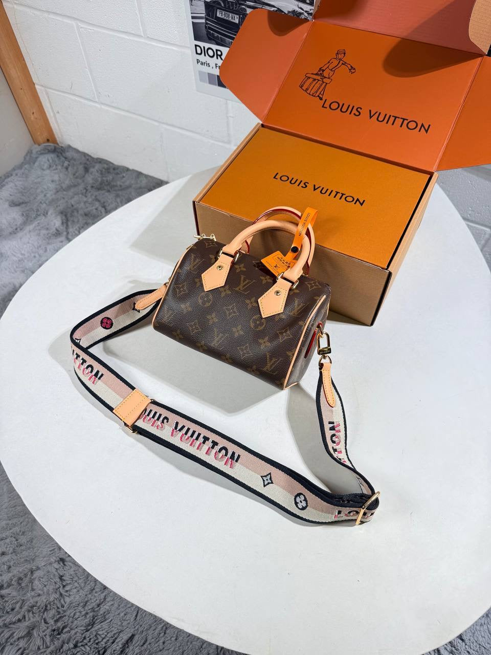 Louis Vuitton nano Speedy bag in monogram canvas with tan leather trim and crossbody strap