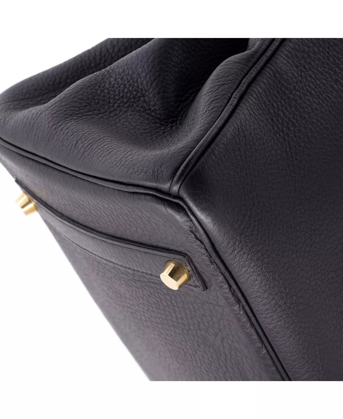Hermès Birkin handbag side with small gold-tone D-ring clasp and textured leather