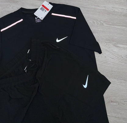 Black Nike running T-shirt and shorts set, crewneck tee with pink side stripe accents
