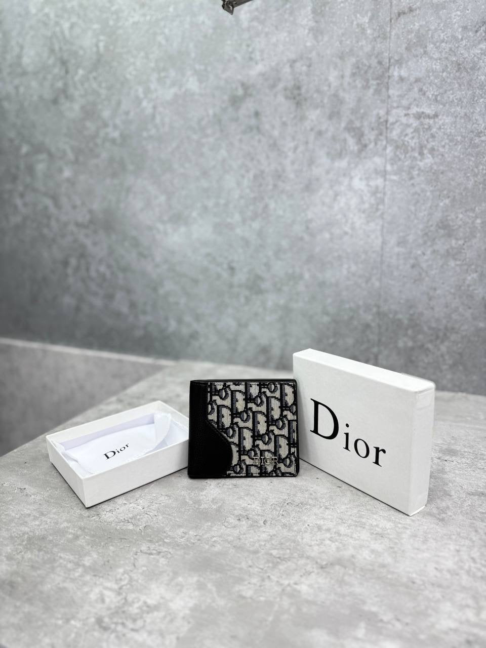 Diorr black monogram bifold wallet angled view with front logo panel