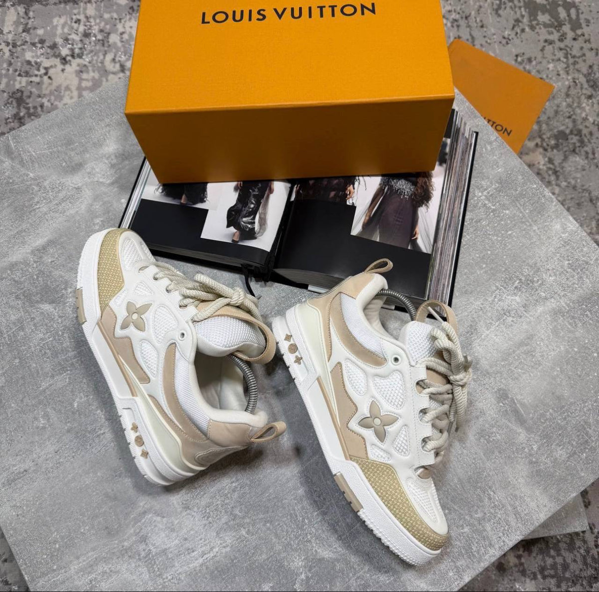 Cream skate sneakers with beige laces, logo flower emblems, chunky white sole