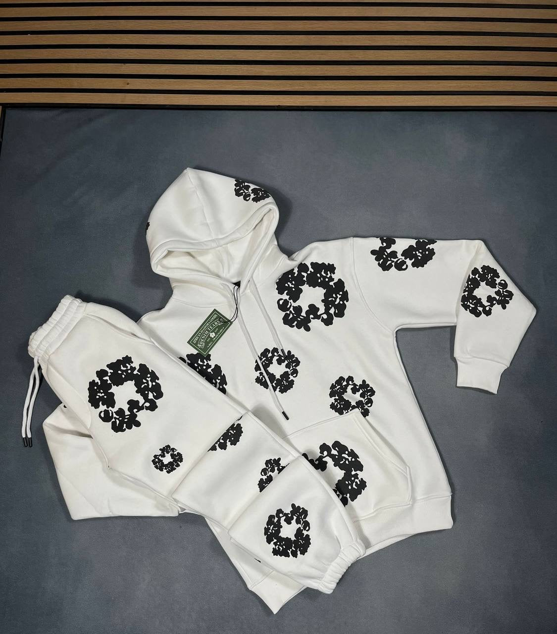 White hoodie and jogger tracksuit set with black floral logo pattern