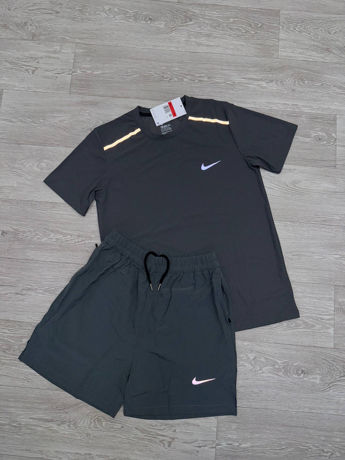 Nike running t-shirt and shorts set with contrasting trim and Nike swooshes on both pieces