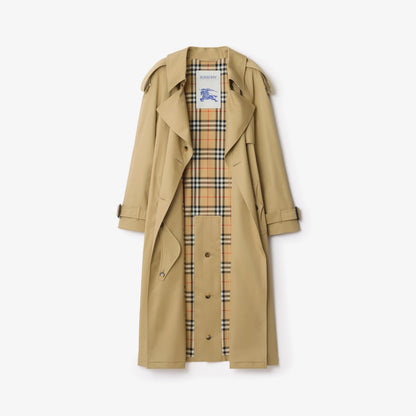Sand beige long gabardine trench coat with plaid lining and buttoned storm front