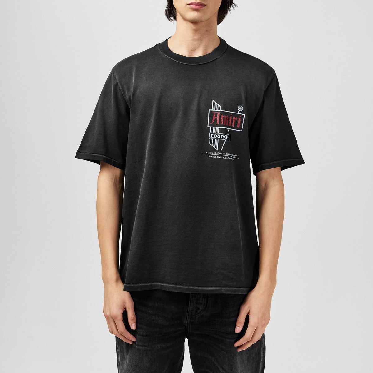 Amiri Vintage Lounge T-Shirt on model, dark grey front logo print