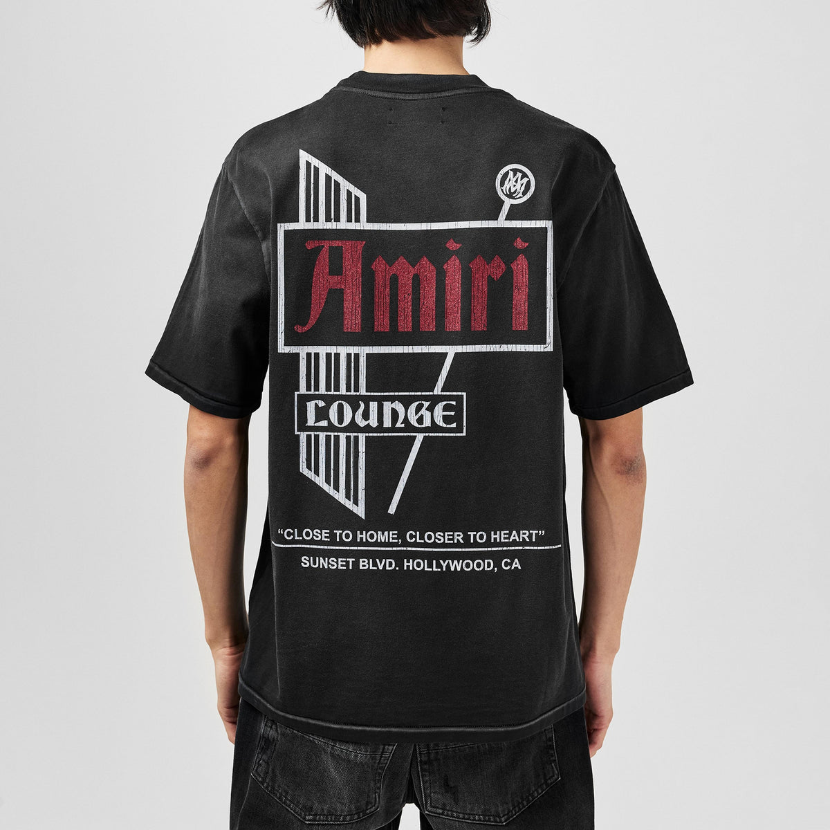 Amiri Vintage Lounge T-Shirt on model, back logo graphic print