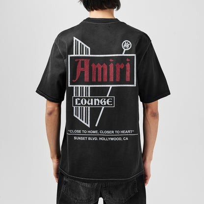 Amiri Vintage Lounge T-Shirt on model, back logo graphic print