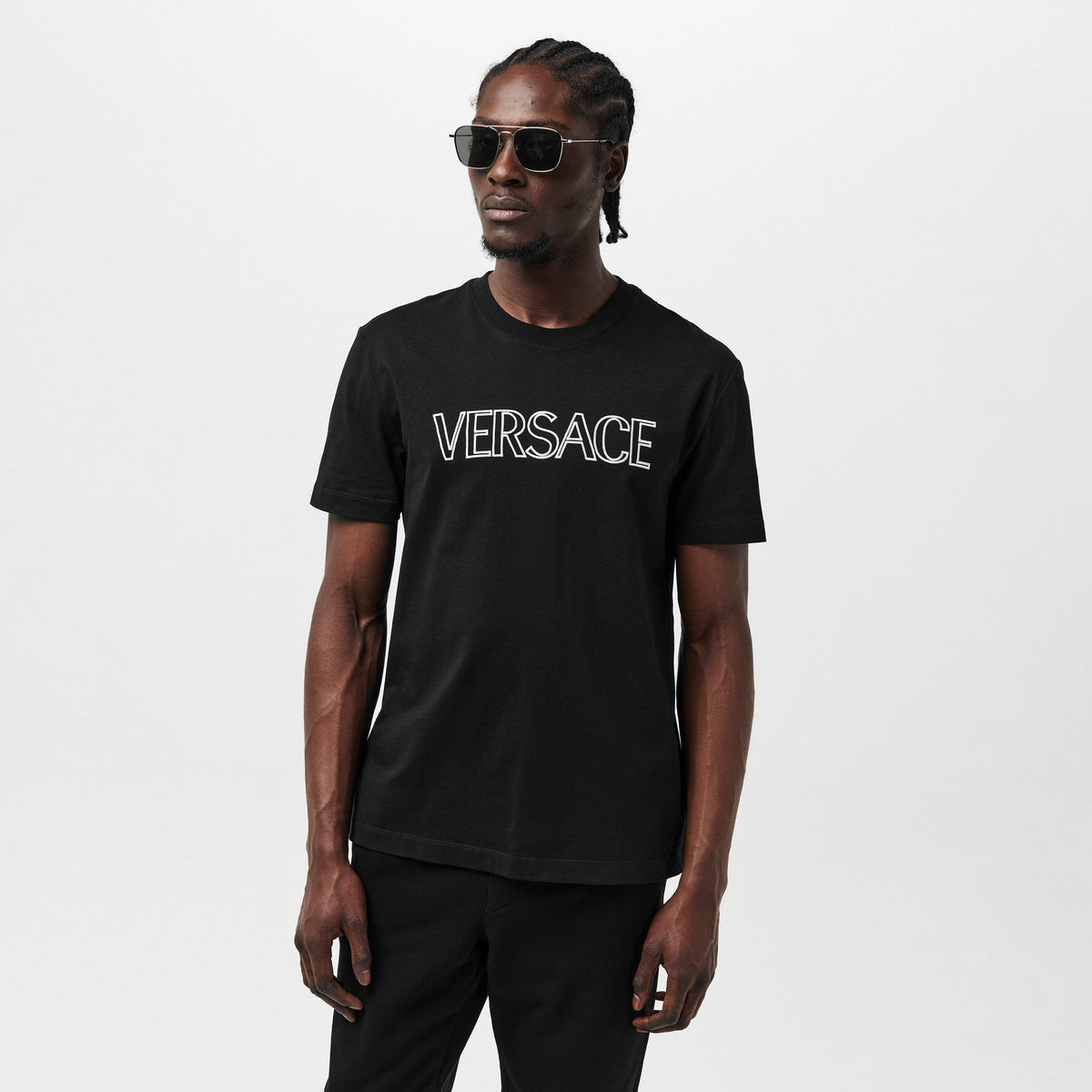 Versace black T-shirt worn by model, white chest logo
