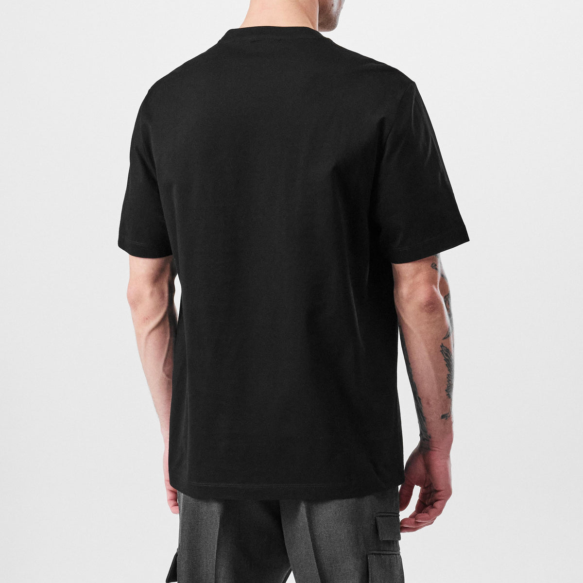 Black T-shirt back view, crew neck with no visible graphic