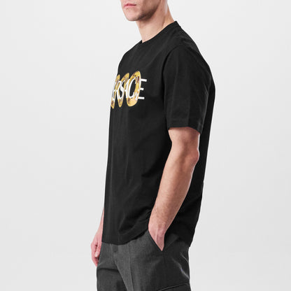 Black T-shirt side view with gold Versace ring logo print at the chest