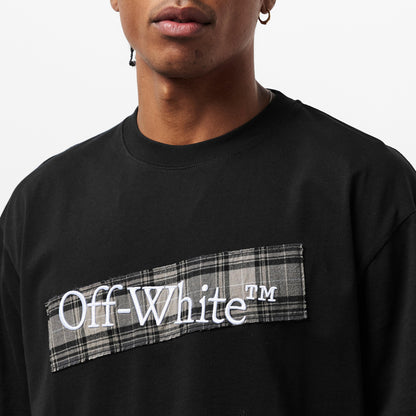 Close-up: black Off-White T-shirt with plaid strip chest logo