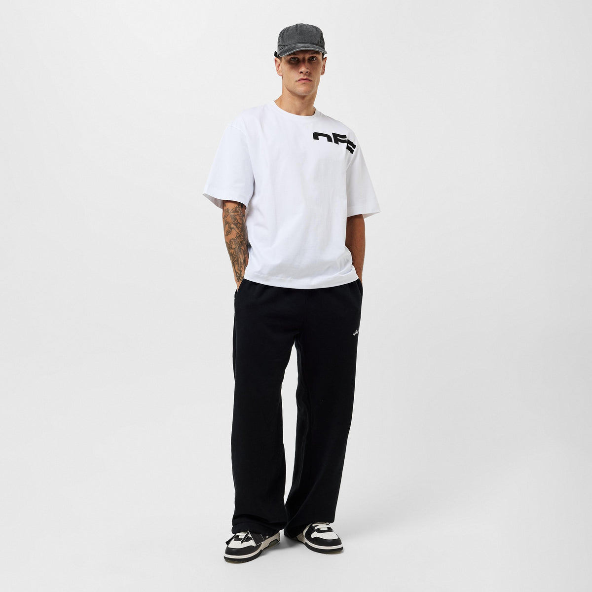 Off White men's regular-fit T-shirt with chest black logo, model front view