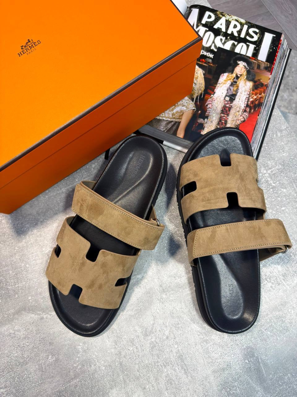 Tan suede slide sandals with black footbed and cutout front, pair with back strap