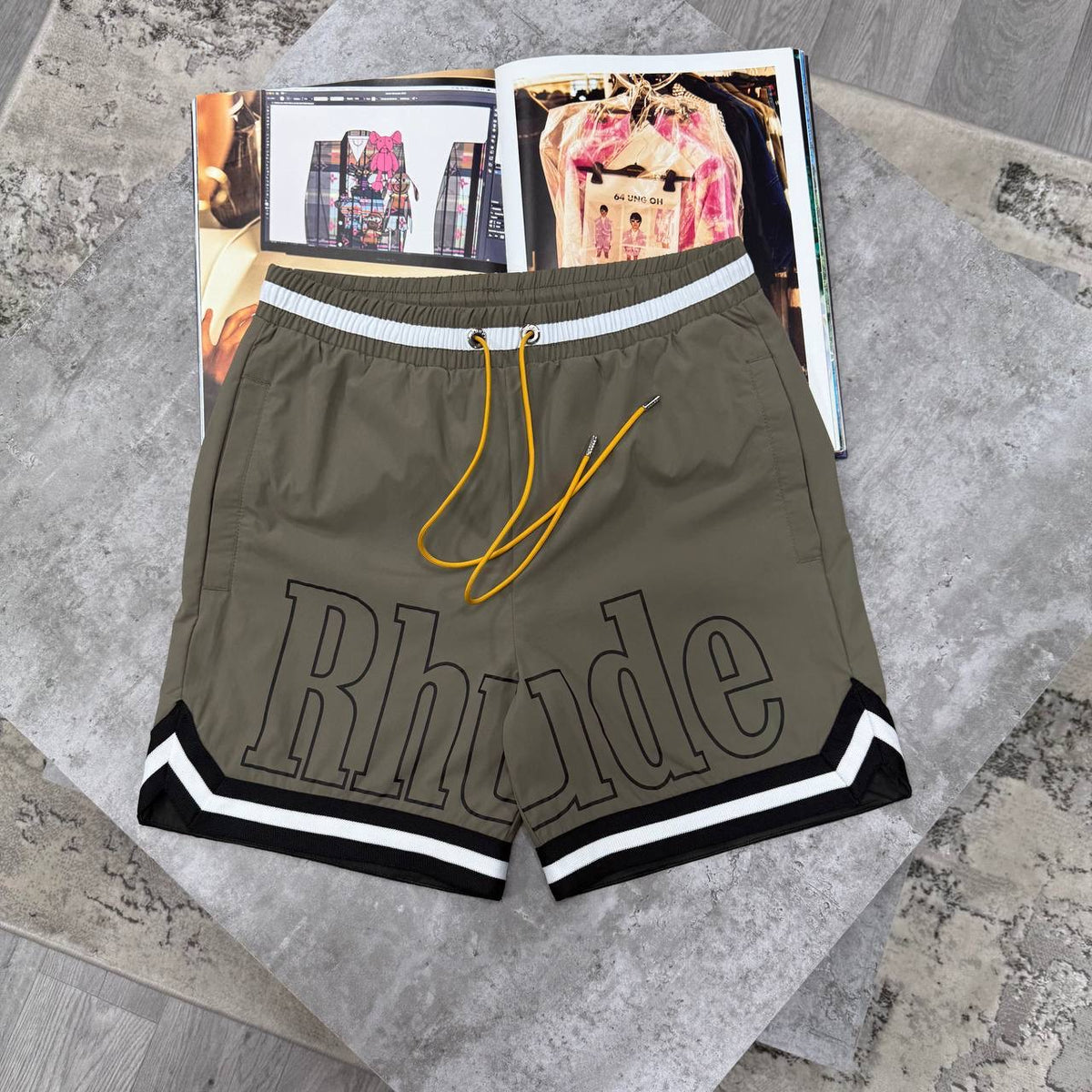 Rhude shorts in olive/khaki with drawstring and white striped hem trim