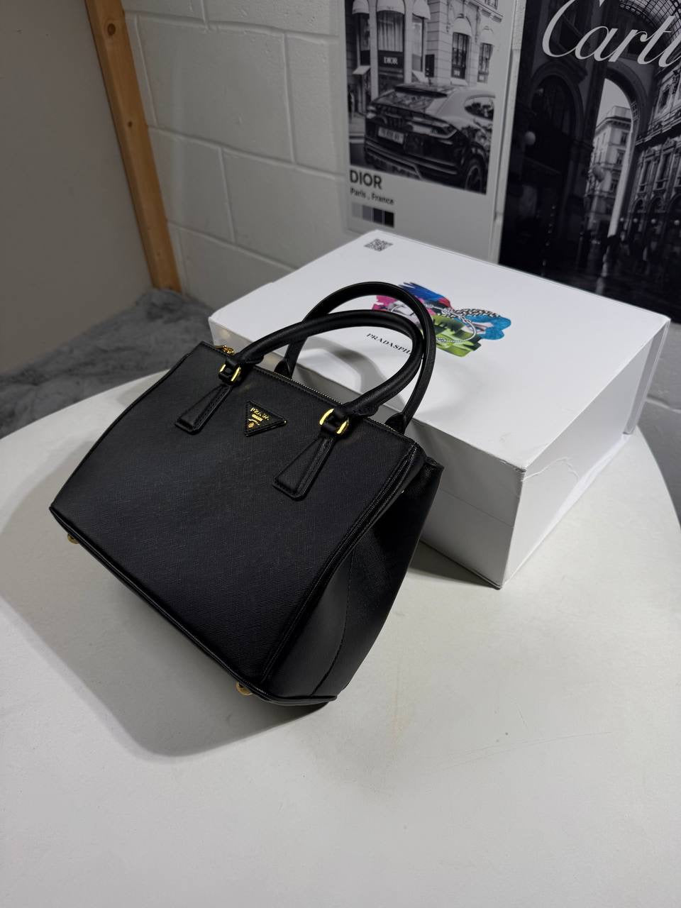 Black LV Alma BB-style handbag with top handles and detachable strap hardware